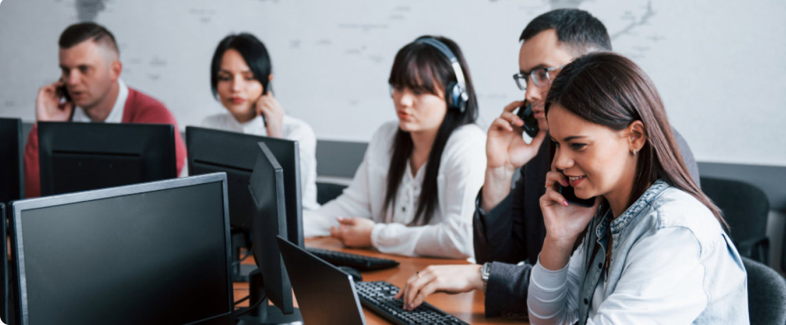 A services team working at their desks